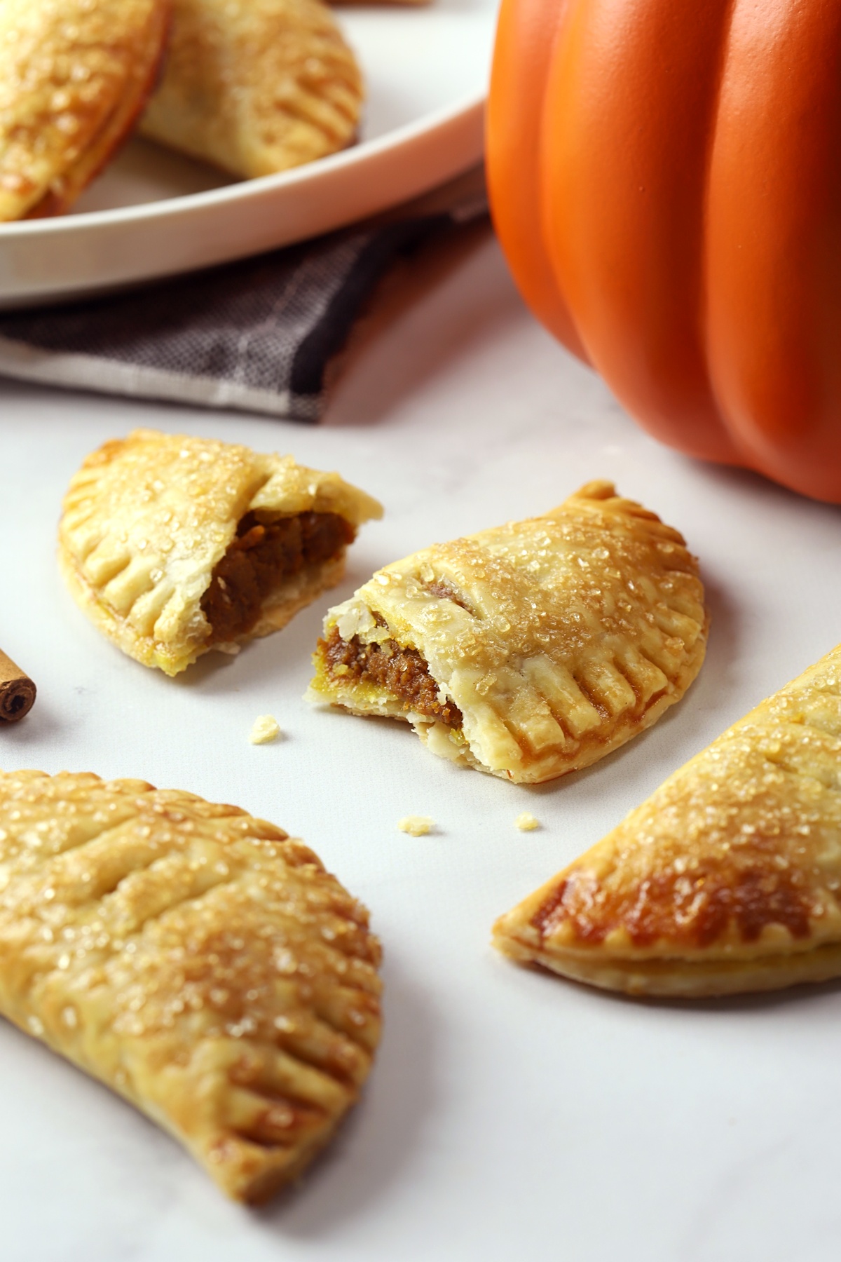 Pumpkin turnover sliced in half to show filling.