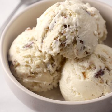 Bowl filled with scoops of ice cream.