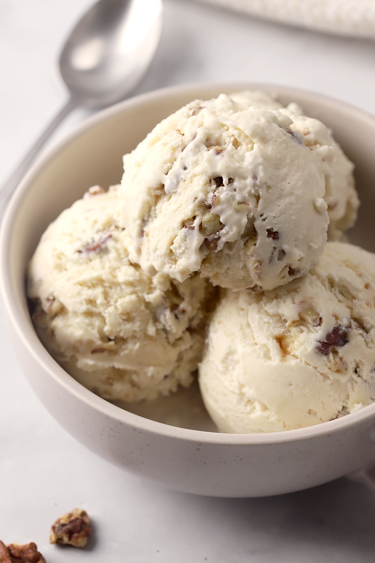 Bowl filled with scoops of ice cream.