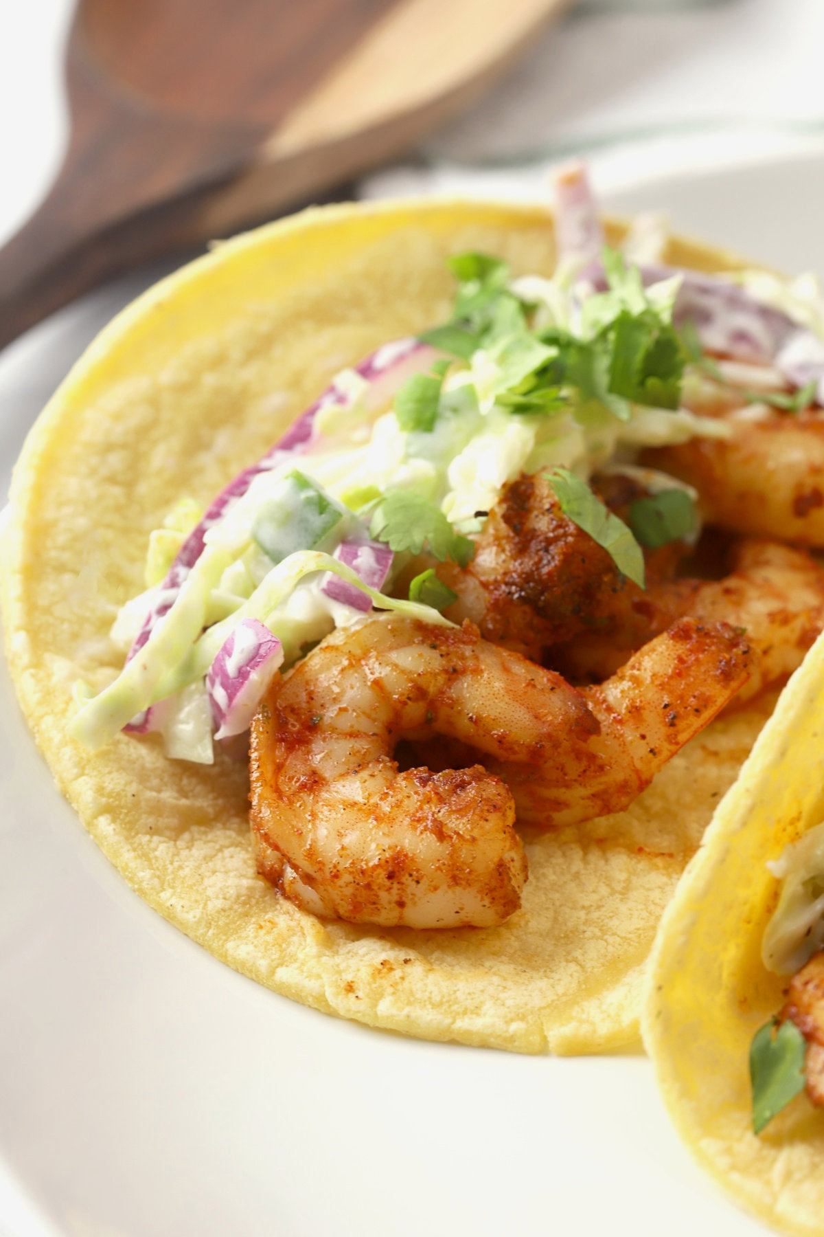 Shrimp in a corn tortilla, topped with cole slaw.