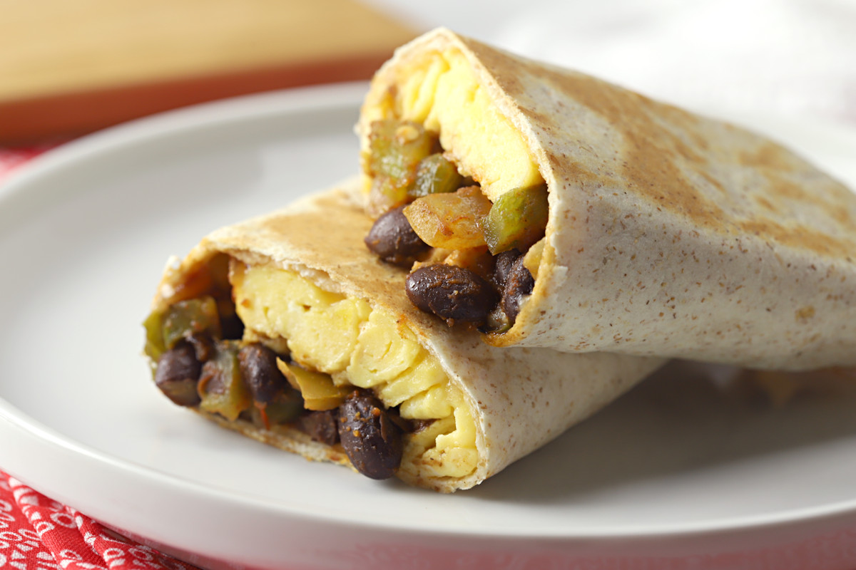 Black bean burrito on a white plate.