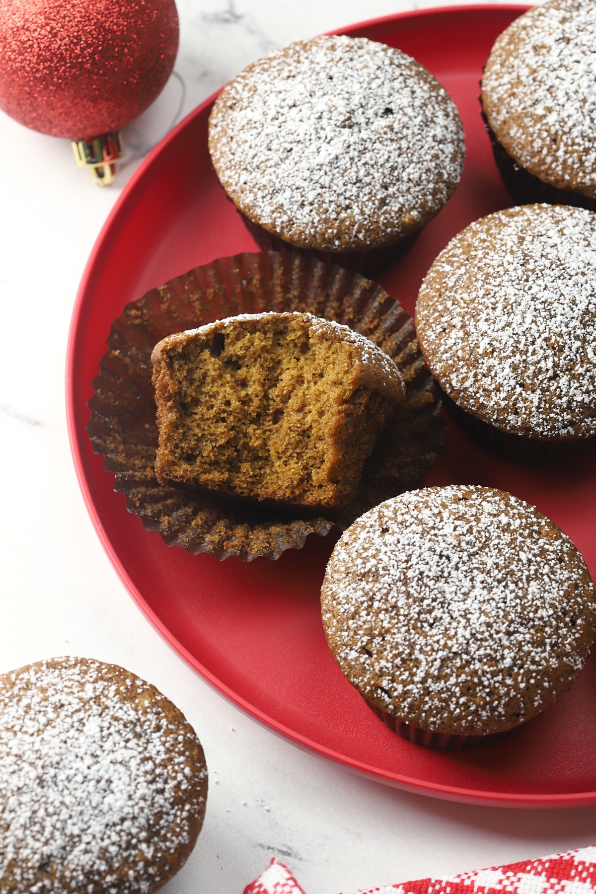 Gingerbread muffins on a red plate.