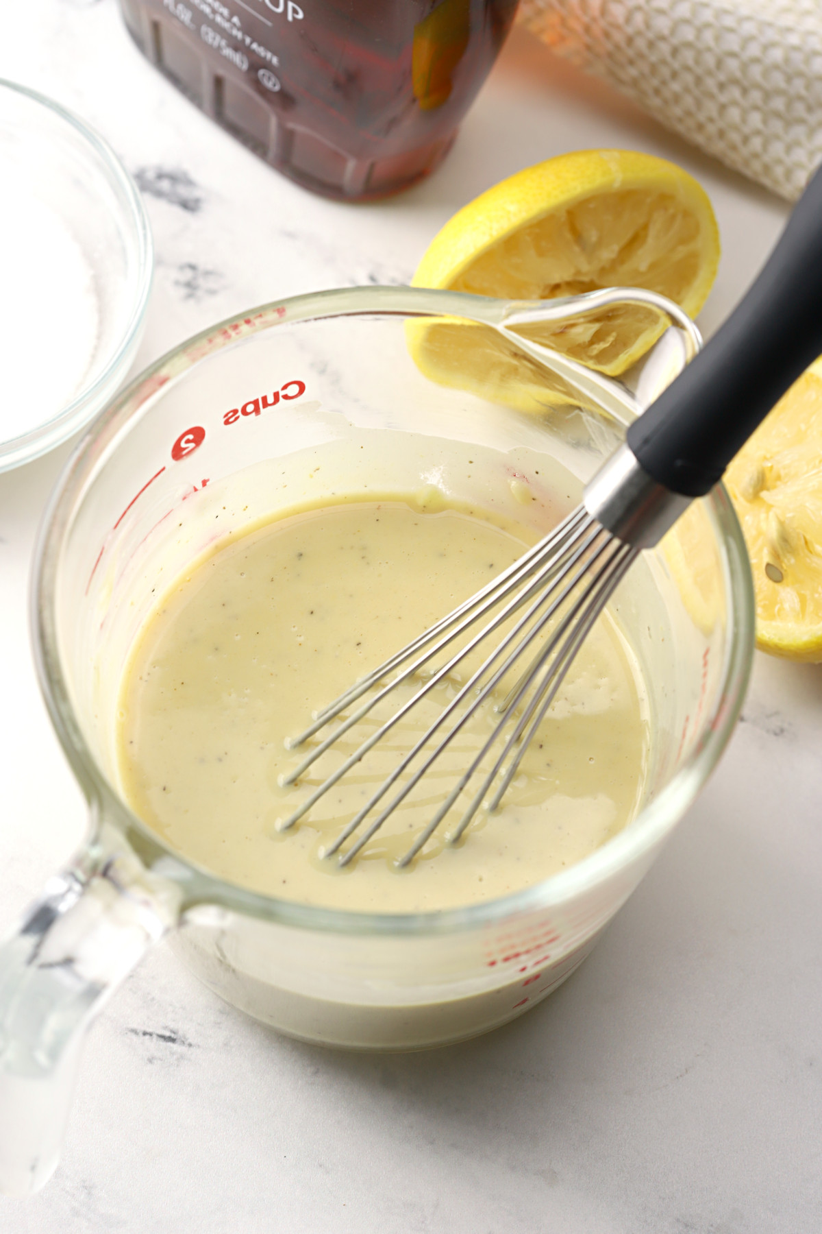 Whisk in a bowl of tahini salad dressing.