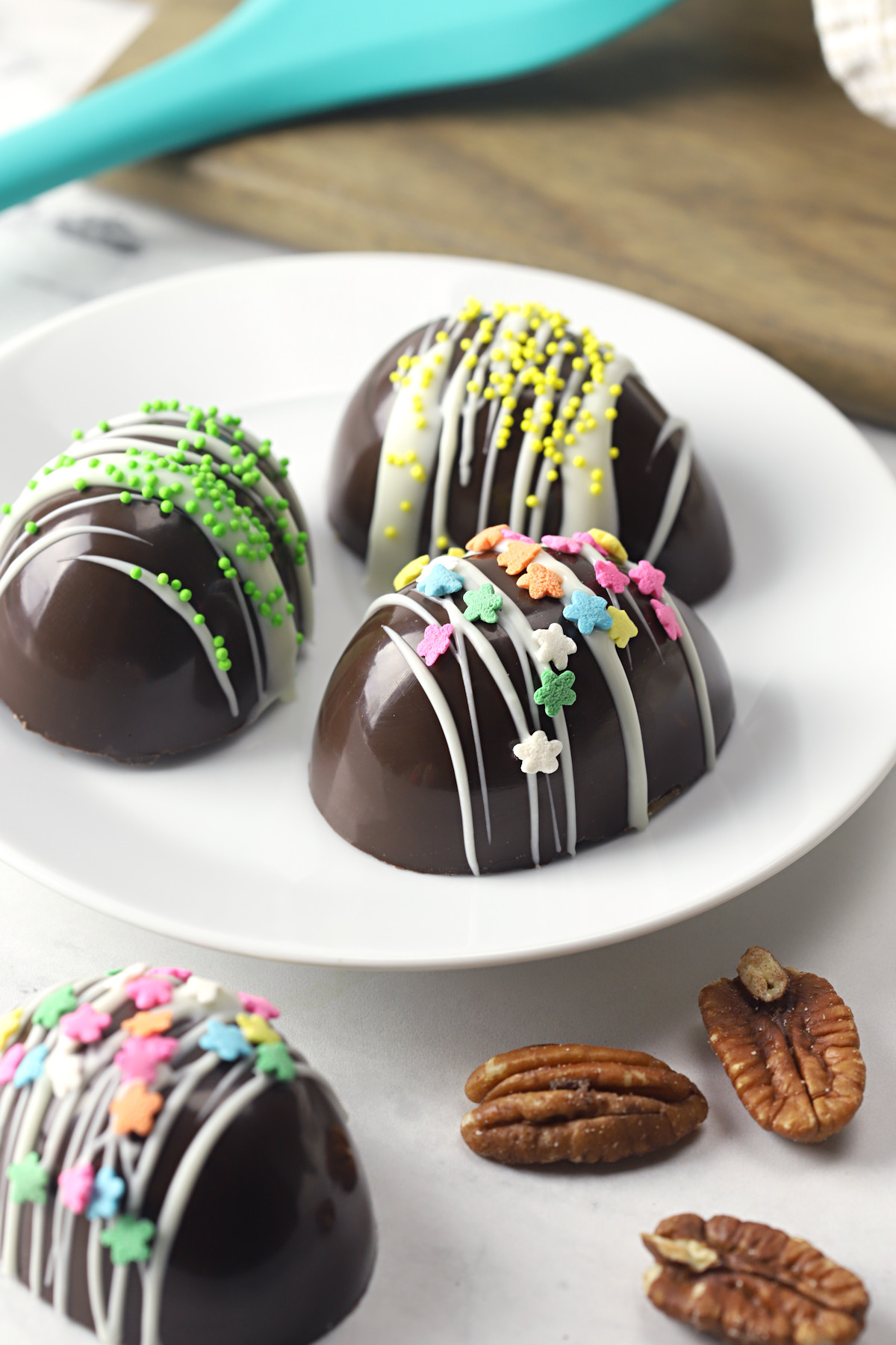 Homemade chocolate easter eggs on a white plate.