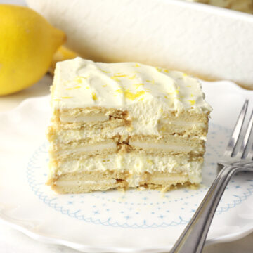 A slice of lemon icebox cake on a white plate.