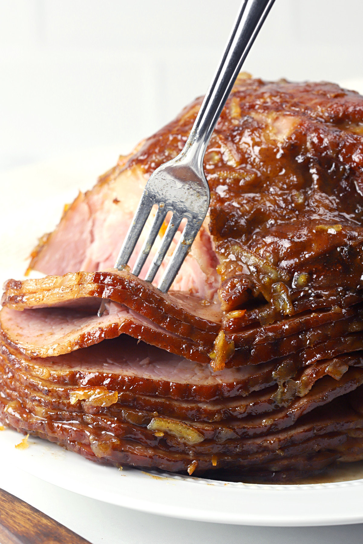 Spiral sliced ham on a white plate.