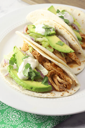 Slow Cooker Shredded Chicken Tacos - The Toasty Kitchen