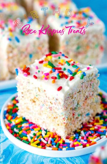 Rice krispies treat filled with rainbow sprinkles and topped with frosting.