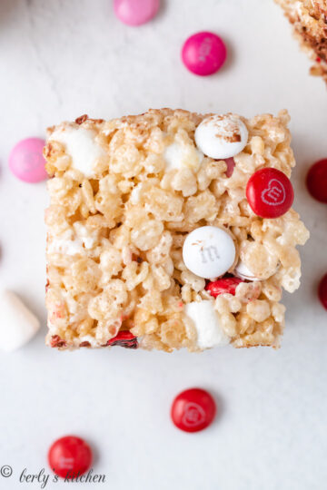 Rice krispies treat filled with valentine's day m&m's candies.