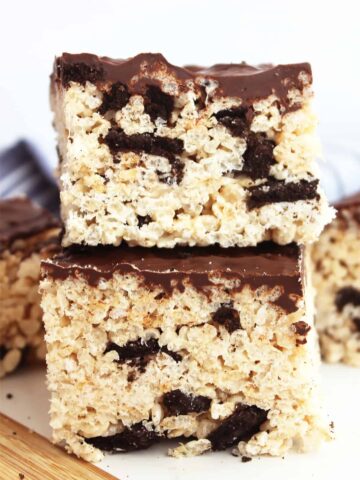 Rice krispies treast filled with oreos and topped with chocolate.