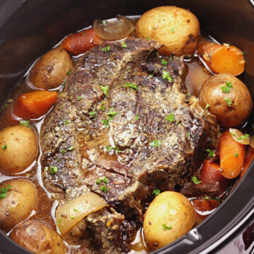 Beef roast in a large slow cooker.
