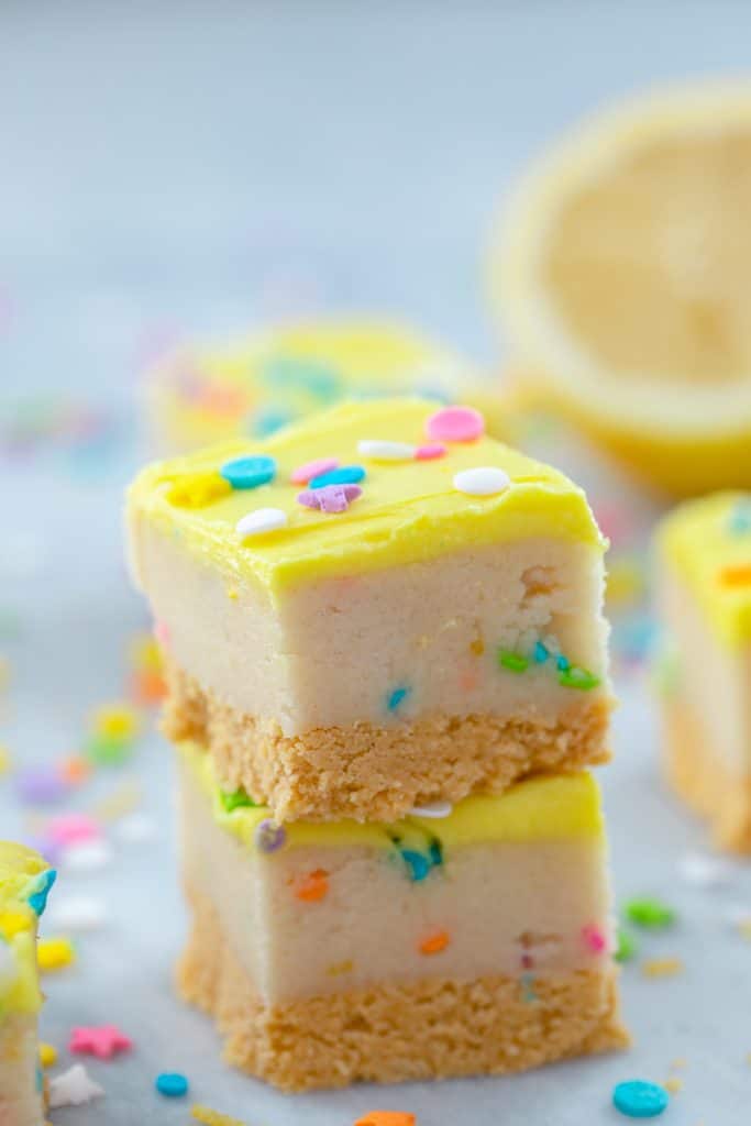 Lemon cookie dough bars stacked on top of each other.