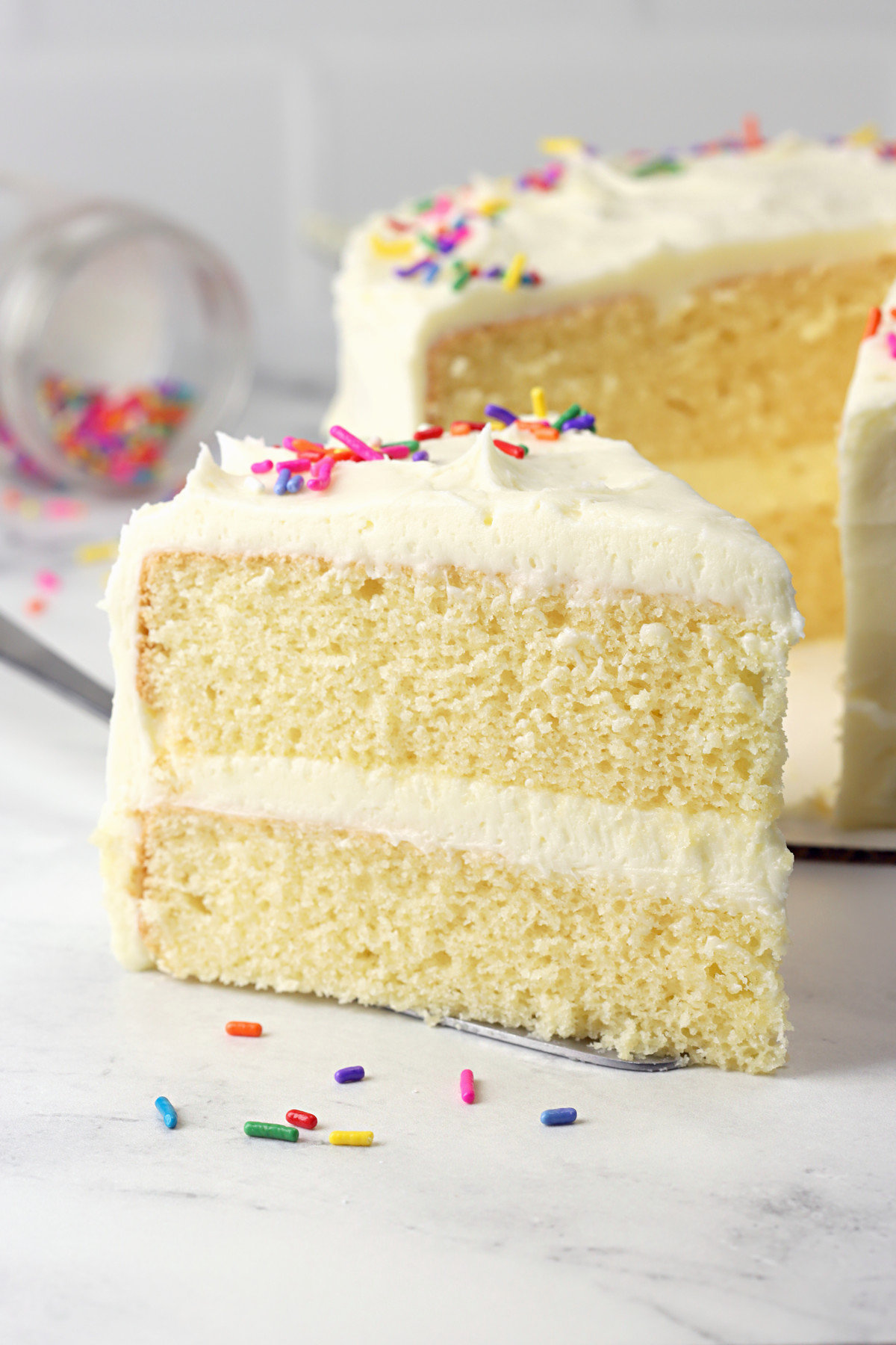 Slice of vanilla layer cake.