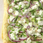 Puff pastry topped with zucchini, onions, and goat cheese.