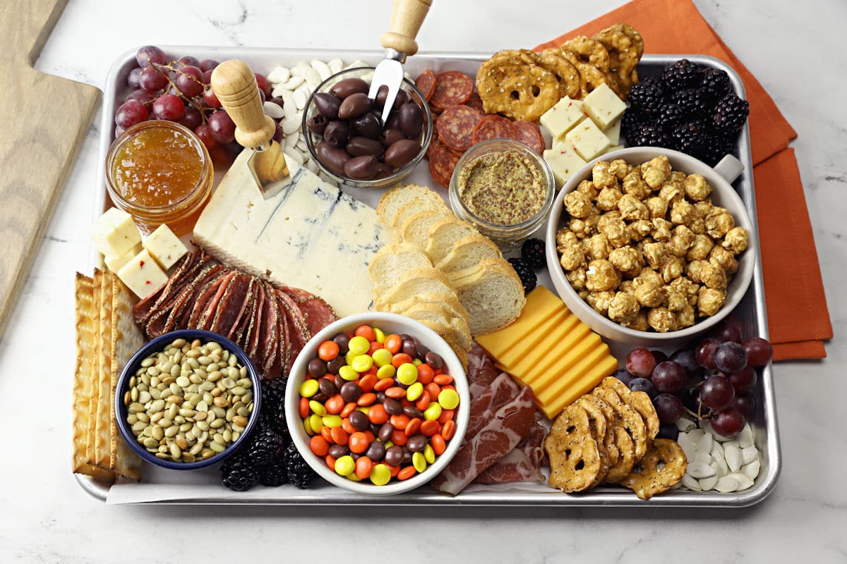 Halloween charcuterie board assembled on a half sheet pan.