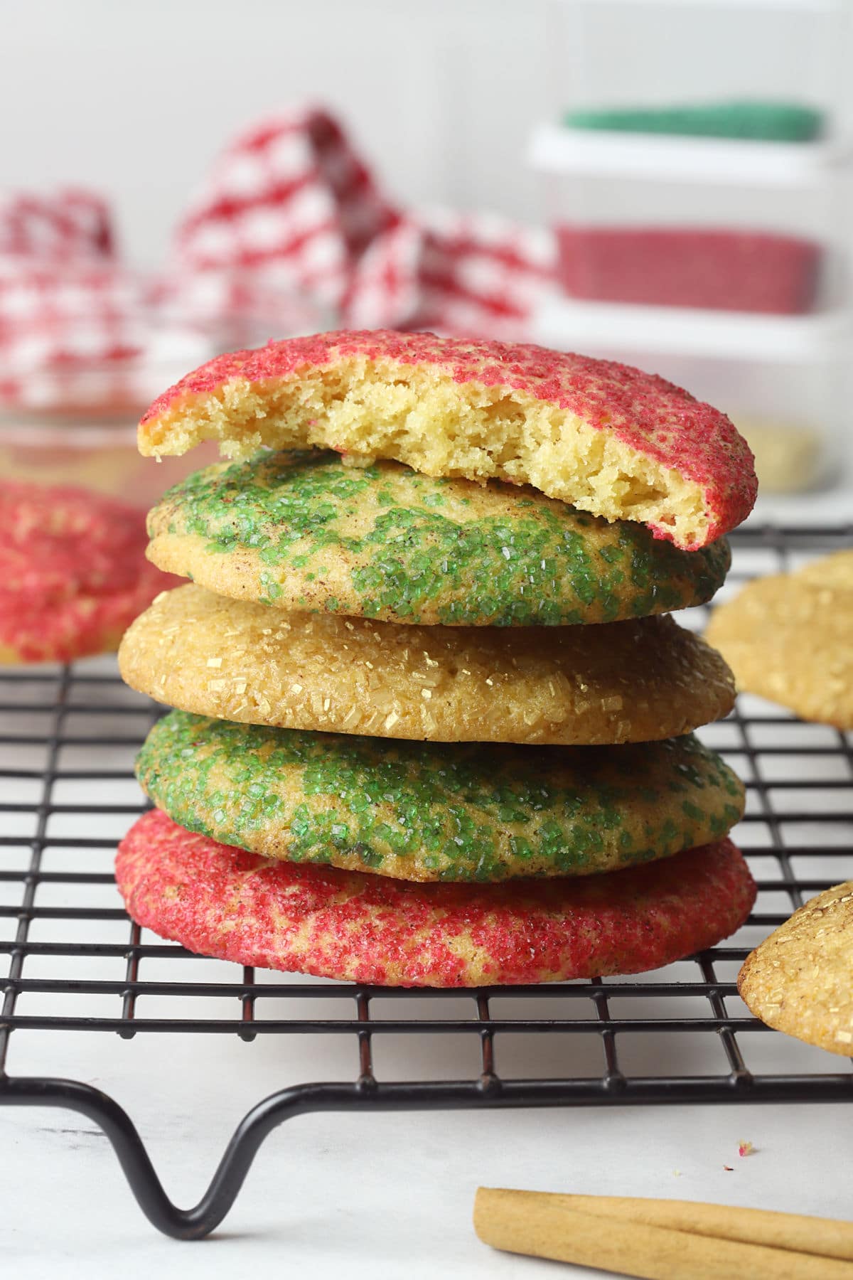 A stack of snickerdoodle cookies on a cooling rack.