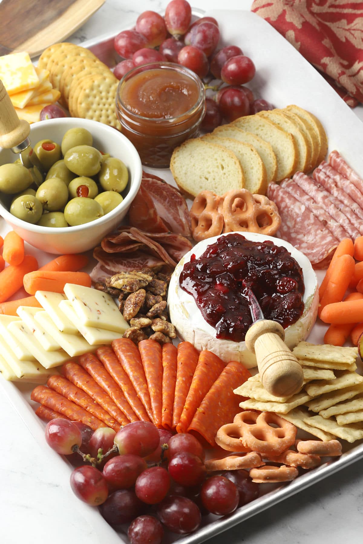 Meats and cheeses assembled onto a tray.