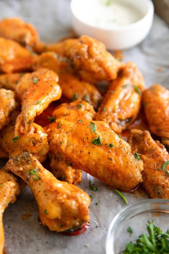 Baked buffalo chicken wings on a countertop.