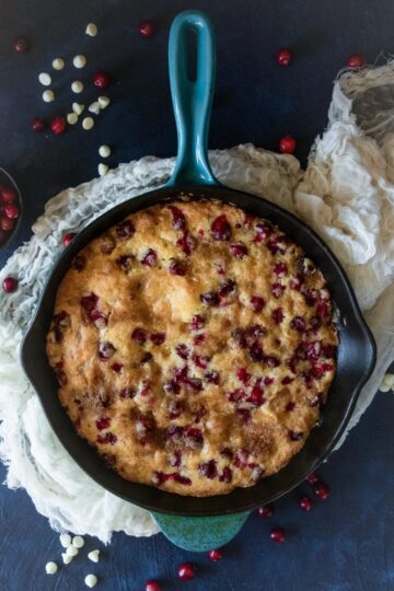 Fresh cranberry skillet cake in a cast iron pan.