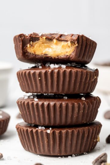 Stack of peanut butter cups on a counter top.