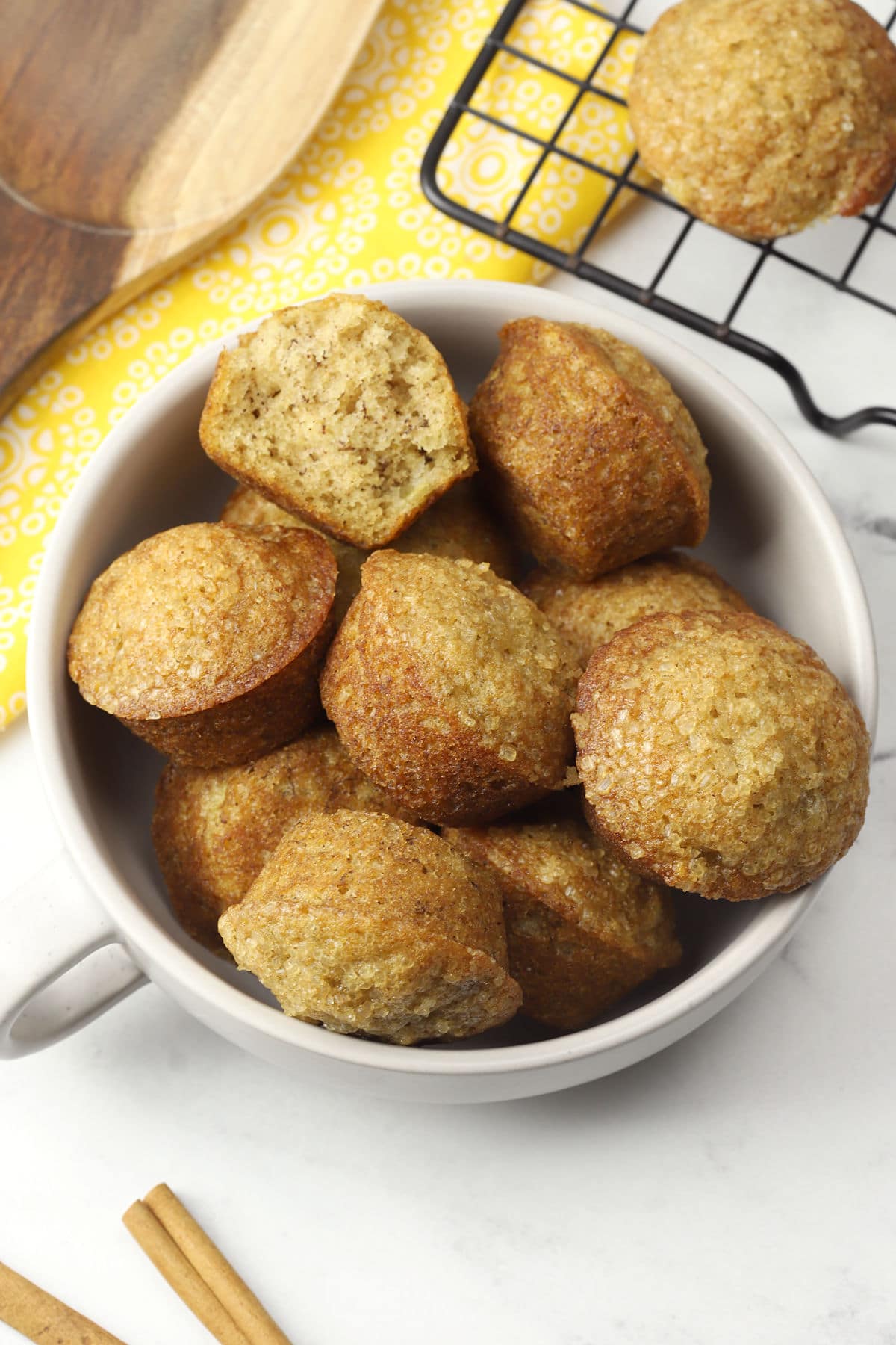 Mug filled with banana mini muffins.