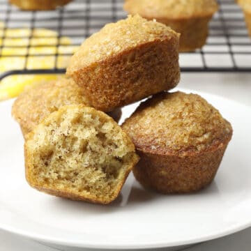 Banana mini muffins on a small white plate.