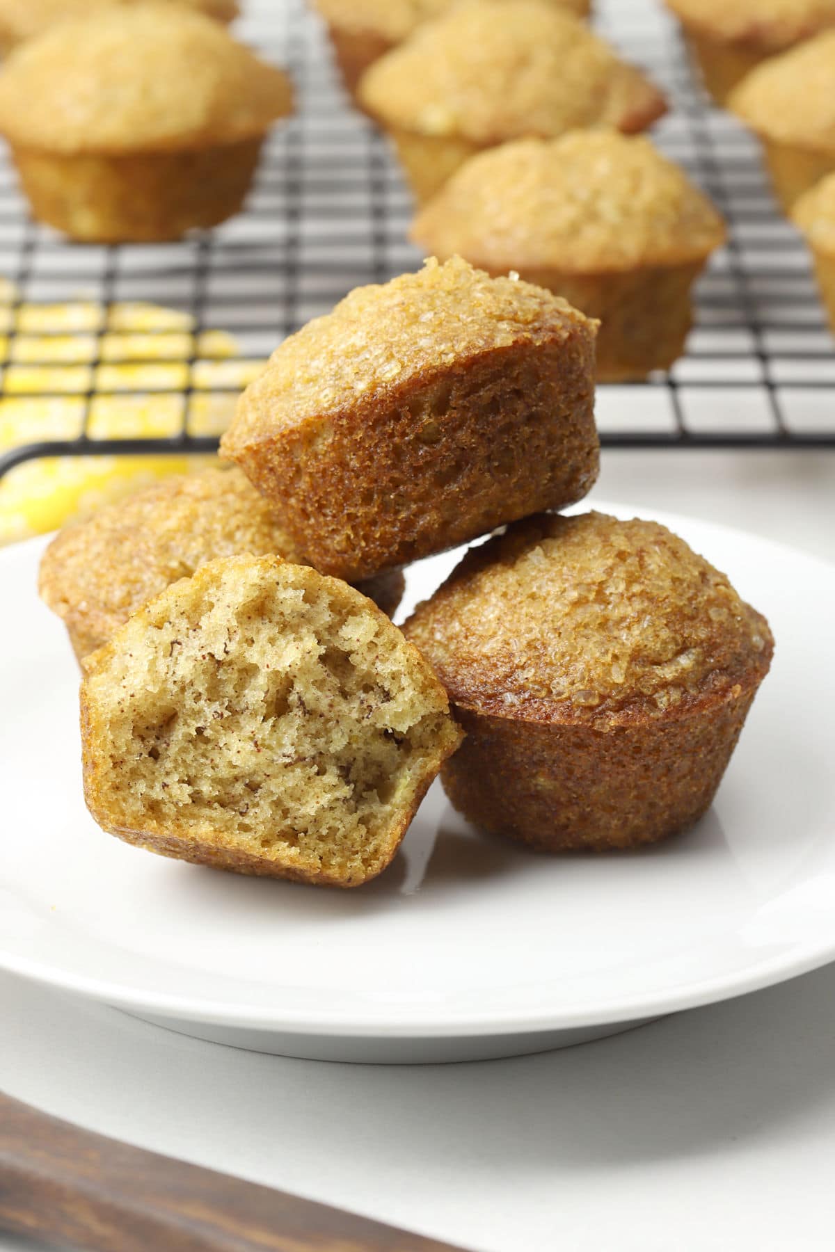 Banana mini muffins on a small white plate.