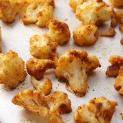 Roasted cauliflower on a sheet pan.