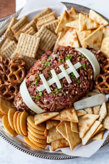 Cheese ball shaped and decorated to look like a football, served with crackers.