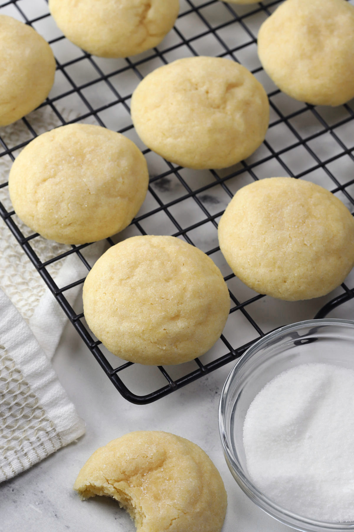 Soft sugar cookies on a cooling rack.