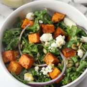 White bowl filled with sweet potato feta salad.