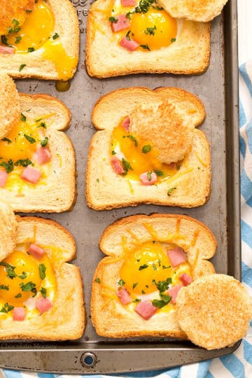 A baking sheet of ham, cheese, and egg toast.