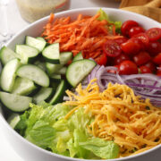 Garden salad ingredients in a large serving bowl.