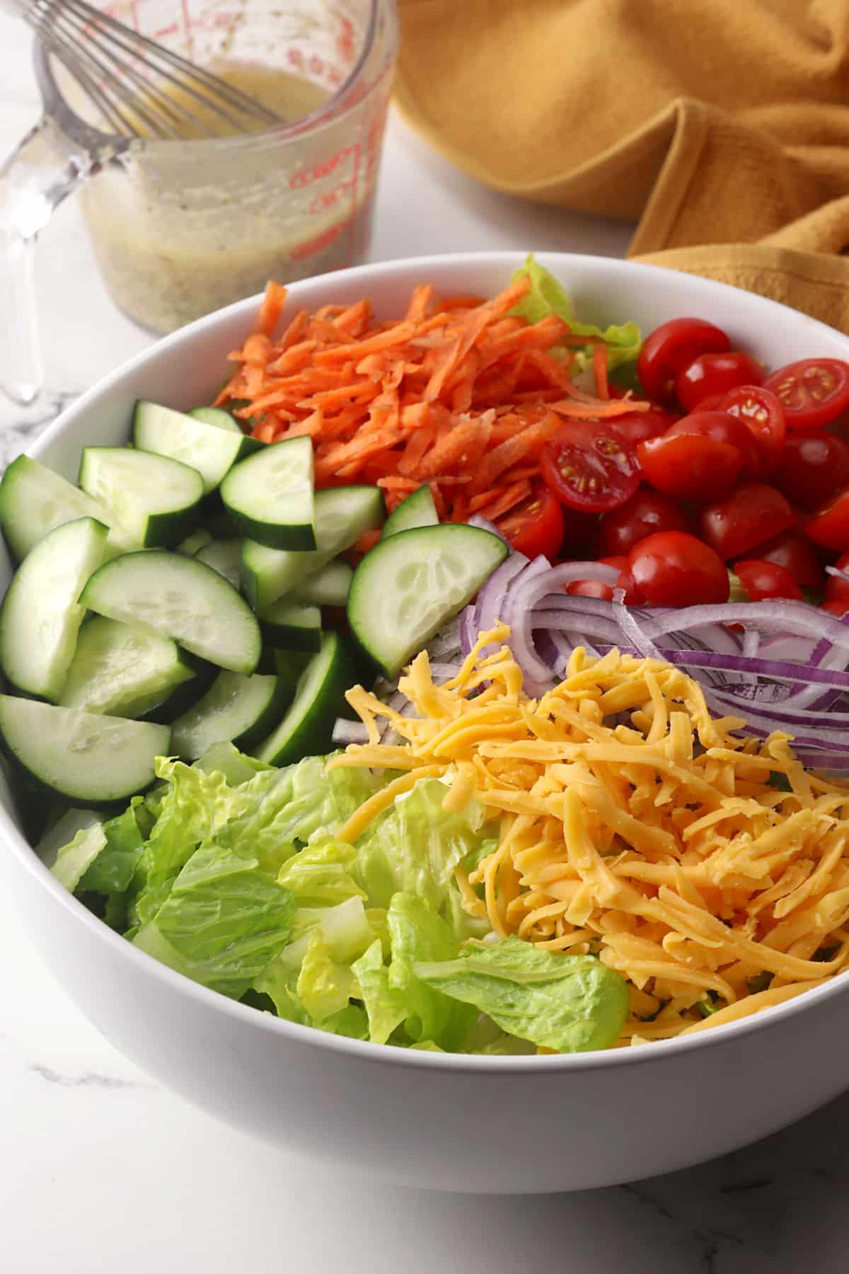 Garden salad ingredients in a large serving bowl.