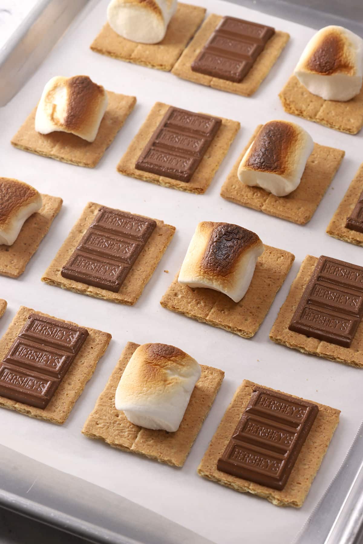 Oven baked s'mores on a sheet pan.