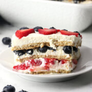 A slice of summer berry icebox cake on a serving plate.
