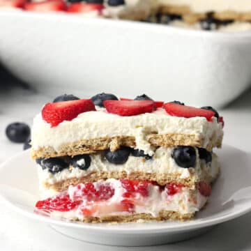 A slice of summer berry icebox cake on a serving plate.