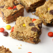 Closeup of monster cookie bars on a counter with Reese's pieces candies.