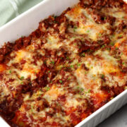 Lasagna roll ups in a casserole dish.