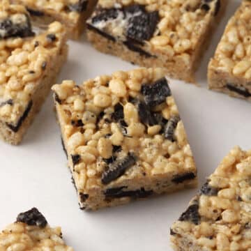 Peanut butter Oreo rice krispies treats laying on a counter top.
