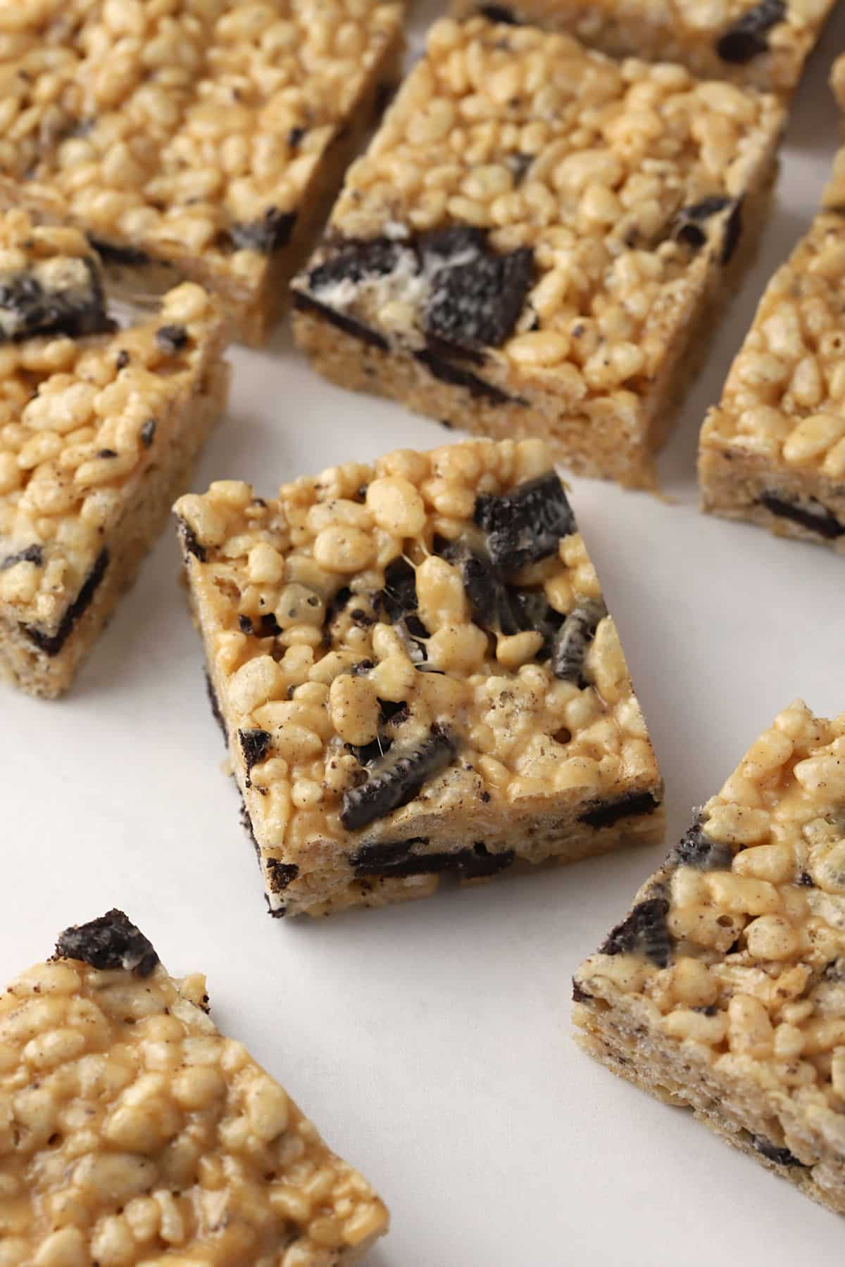 Peanut butter Oreo rice krispies treats laying on a counter top.