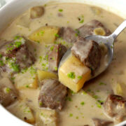 A spoonful of steak and potato soup.