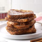 A stack of cinnamon french toast on a plate.