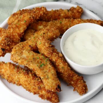 Ranch chicken tenders on a plate.