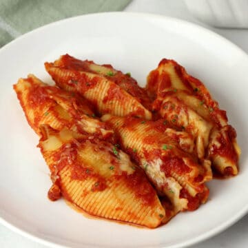 Cheese stuffed shells on a plate.
