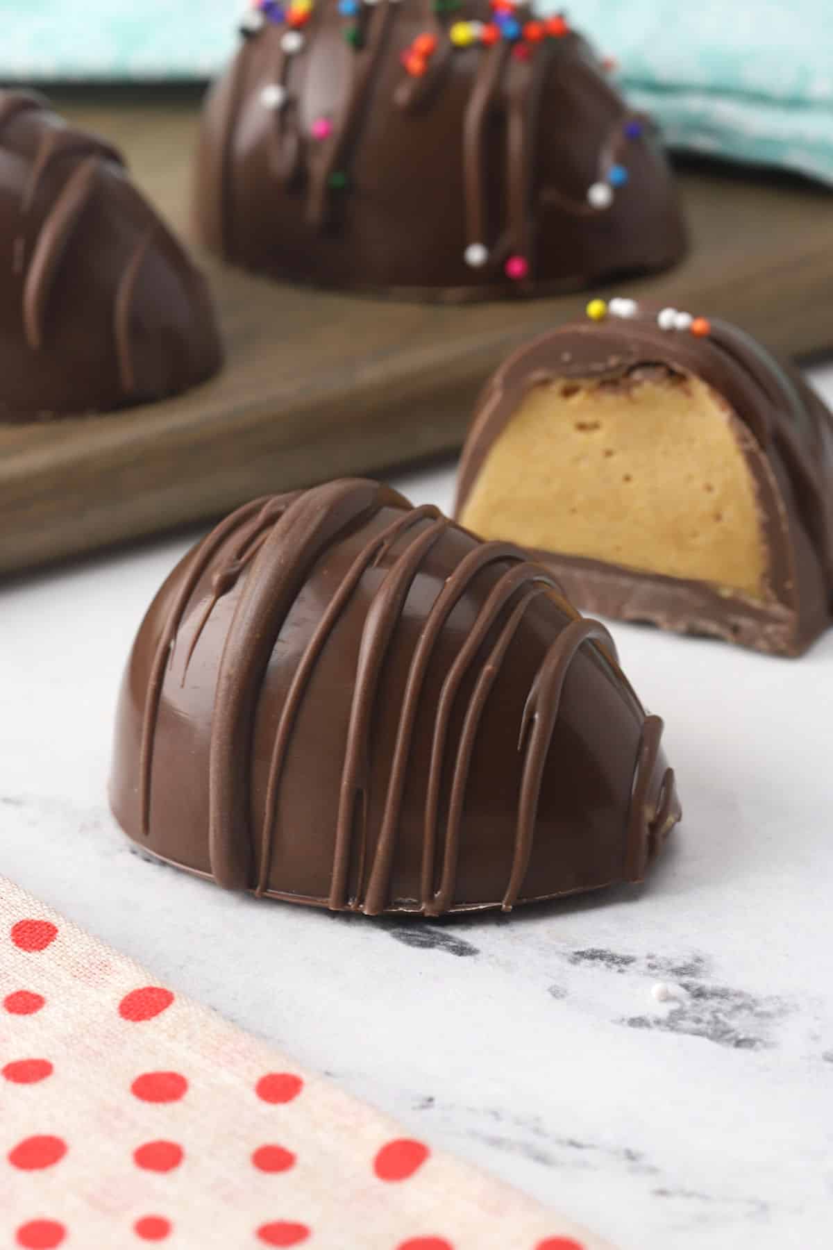 Easter egg candy split open to show peanut butter interior.