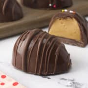 Easter egg candy split open to show peanut butter interior.