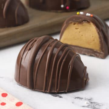 Easter egg candy split open to show peanut butter interior.