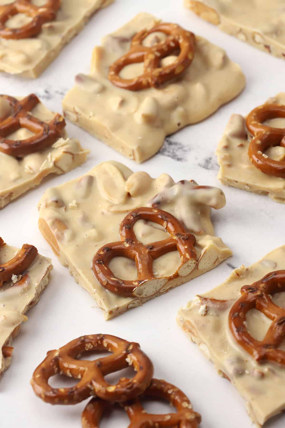 Squares of peanut butter pretzel bark.