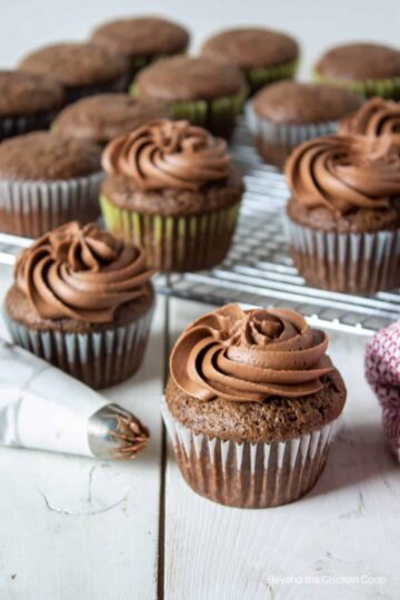 Chocolate cupcakes on a cooling rack.
